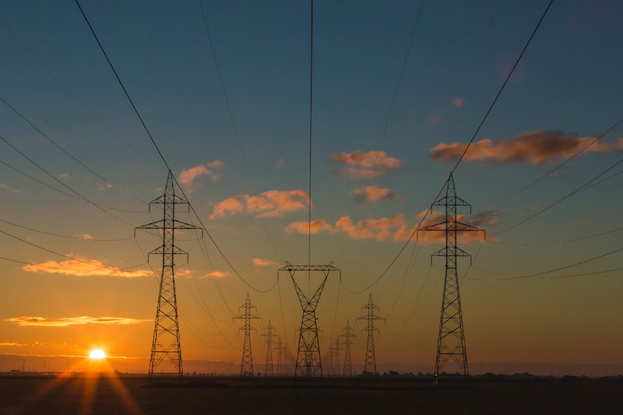 Electrical transmission towers at sunset